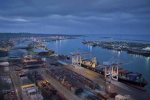 Aerial view of a container port terminal at dusk